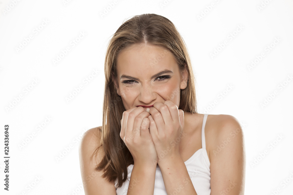 Nervous beautiful happy girl on white background Nervous beautiful happy girl on white background