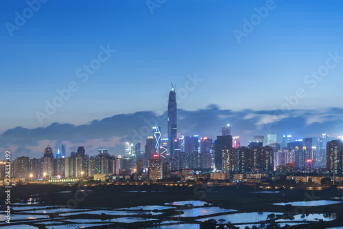 Skyline of Shenzhen City, China at twilight. Viewed from Hong Kong border