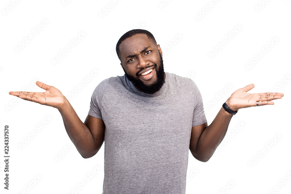 Attractive dark skinned amazed male businessman has discontent expression, doesn`t agree with mark, argues with collegues, isolated on white background. Emotional African American hipster guy indoor Attractive dark skinned amazed male businessman has discontent expression, doesn`t agree with mark, argues with collegues, isolated on white background. Emotional African American hipster guy indoor