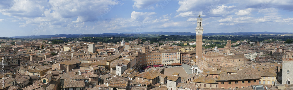 Panorama photo of the cityscape of medieval Siena with old town hall (Palazzo Pubblico) in Tuscany, Italy