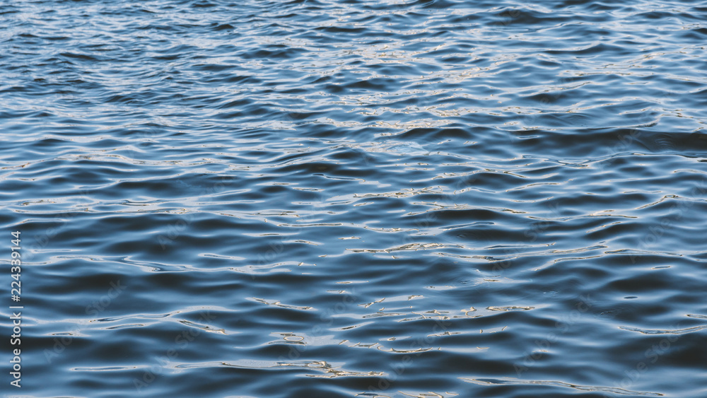 Sea surface as natural background, color toned. Sea surface as natural background, color toned.