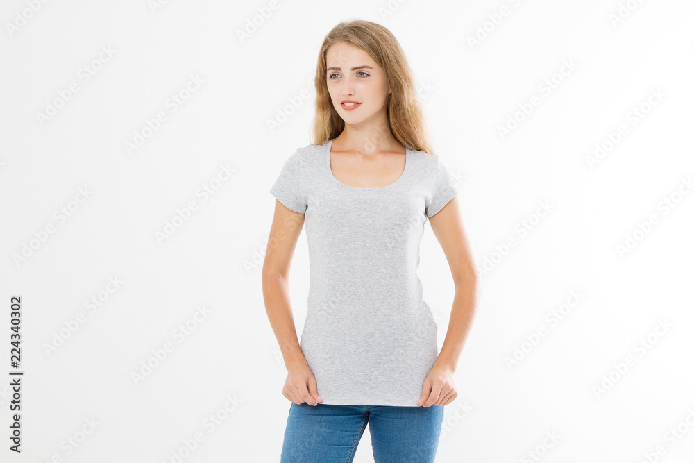 Young blonde woman with fit slim body in blank template t shirt and jeans isolated on white background. Skin and hair care. Copy space and mock up Young blonde woman with fit slim body in blank template t shirt and jeans isolated on white background. Skin and hair care. Copy space and mock up