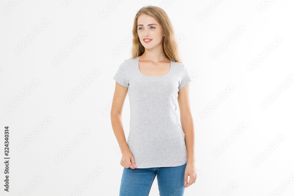 Young blonde woman with fit slim body in blank template t shirt and jeans isolated on white background. Skin and hair care. Copy space and mock up Young blonde woman with fit slim body in blank template t shirt and jeans isolated on white background. Skin and hair care. Copy space and mock up