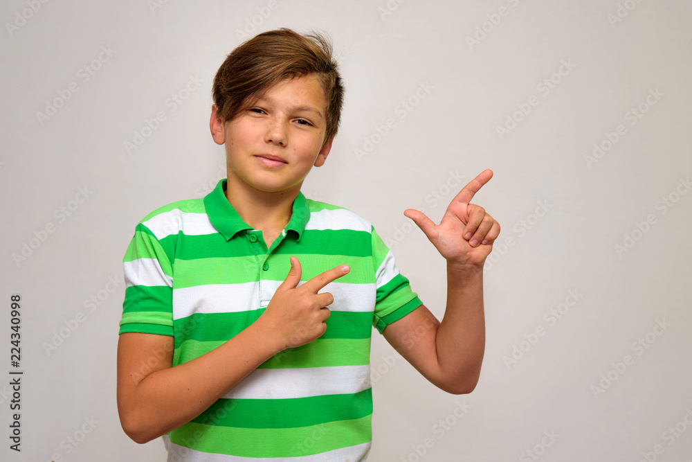Studio portrait of a teenage boy on a white background with different emotions. Studio portrait of a teenage boy on a white background with different emotions.
