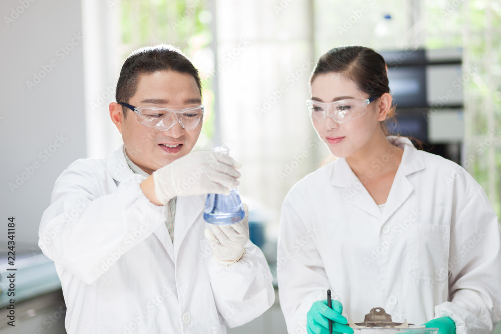 people working at laboratory people working at laboratory