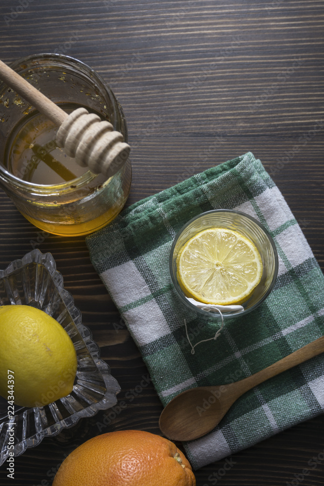 Honey and lemon on wooden background Honey and lemon on wooden background