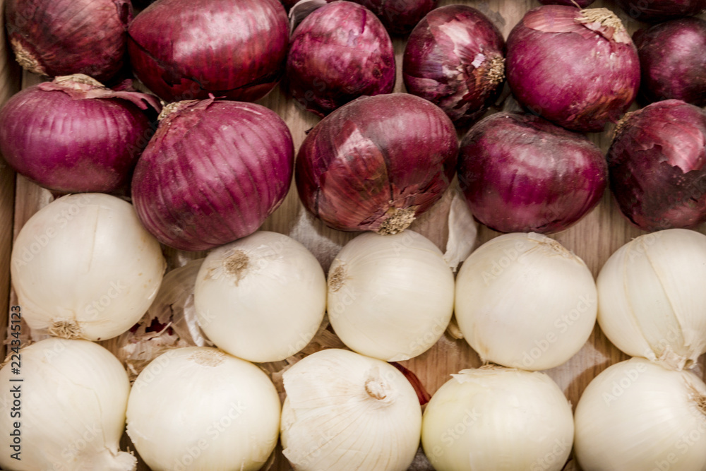 purple and white onions on wooden board purple and white onions on wooden board