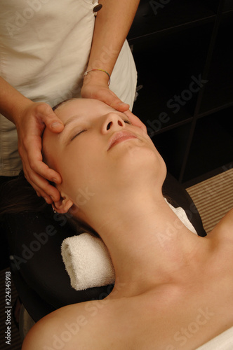 Wallpaper Mural young woman receives skin massage treatment in spa salon Torontodigital.ca