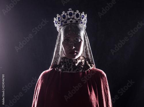 queen with crown, studio portrait on a black background