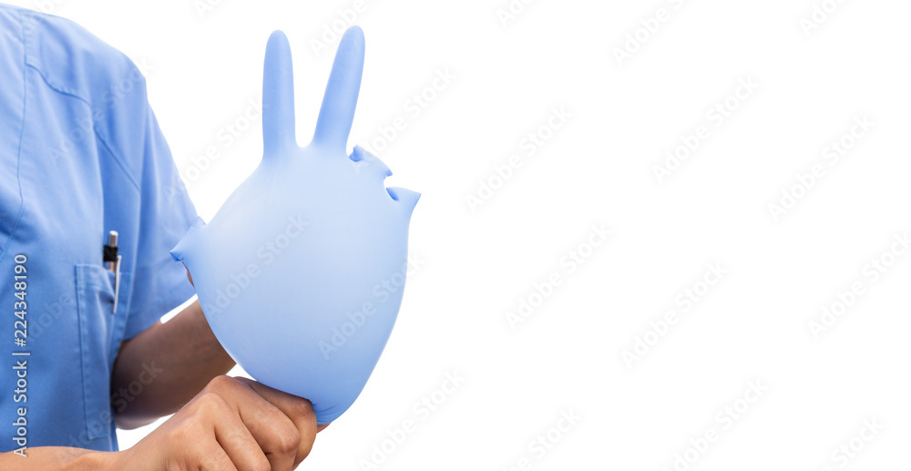 Fototapeta premium Woman nurse holding inflated surgical glove making peace gesture.