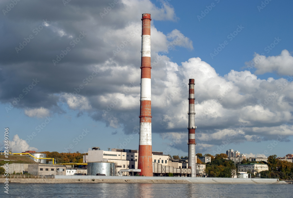 Industrial zone on the river. Chimney.