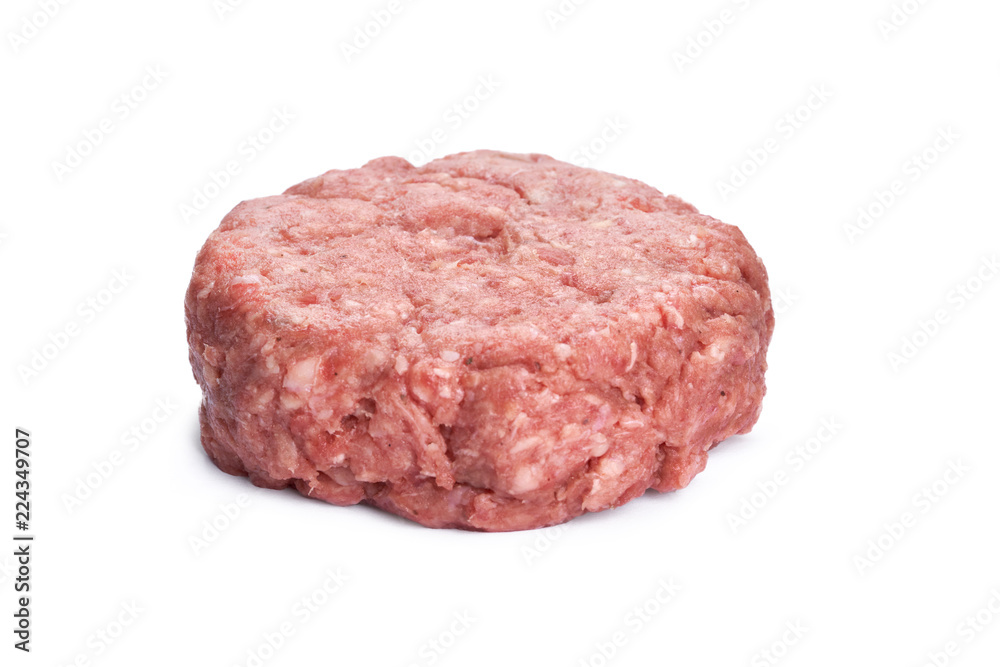 A side view of a raw beef burger isolated on a white background.