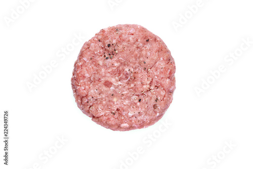 A top view of a raw beef burger isolated on a white background.