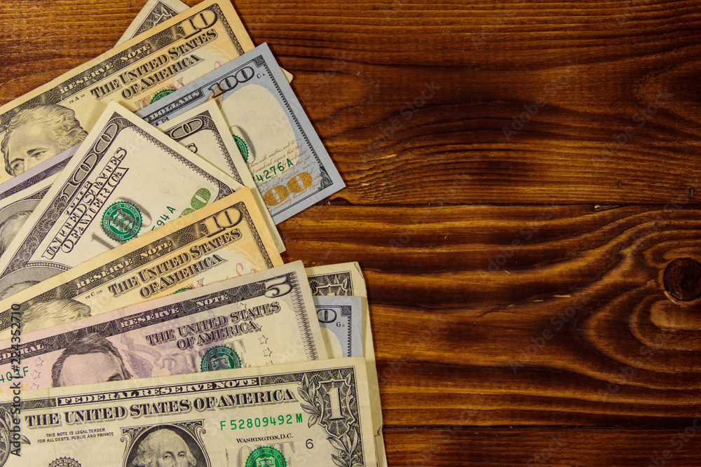 American dollars on wooden background. Top view, copy space American dollars on wooden background. Top view, copy space