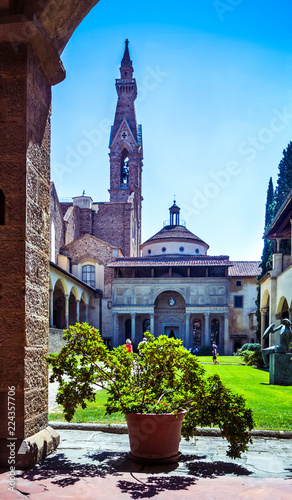 Basilica di Santa Croce  (Basilica of the Holy Cross) courtyard with bell tower, garden and flowers, Florence Firenze, Italy © lara-sh