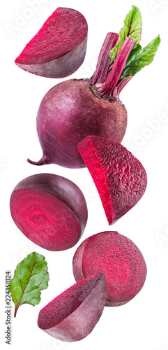 Red beet or beetroot and slices on white background.