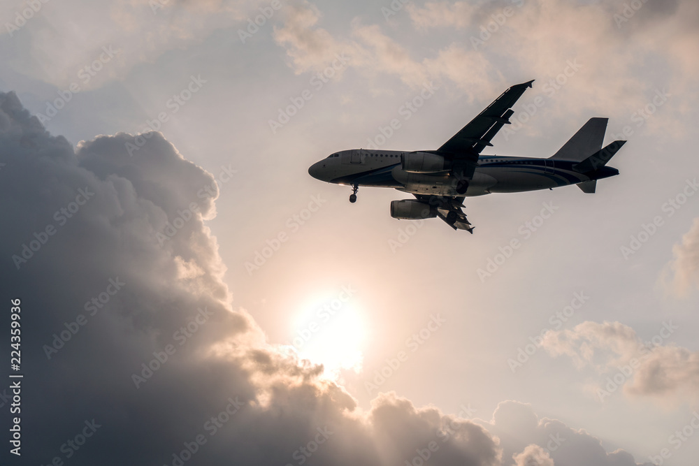Flying Airplane in the sky with Sun and clouds