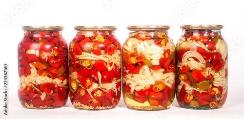 collection set of canned vegetables in glass jars isolated on white background
