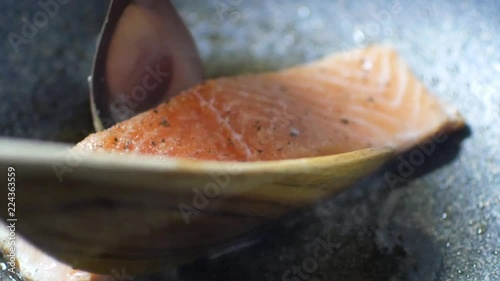 Fresh norwagian orange salmon fish filet was fried in the pan for salmon steak photo