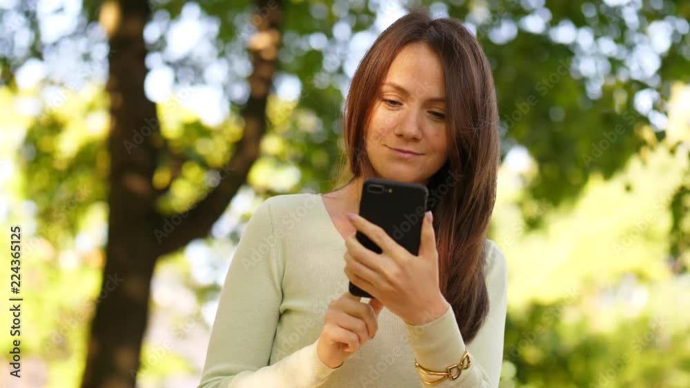 Woman browsing in smartphone Woman browsing in smartphone