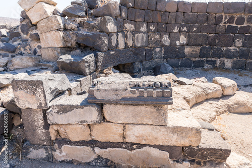 The  remains of the column in the ruins of the Greek - Roman city of the 3rd century BC - the 8th century AD Hippus - Susita on the Golan Heights near the Sea of Galilee - Kineret, Israel photo