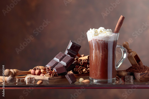 Cocoa with cream, cinnamon, chocolate pieces and various spices.