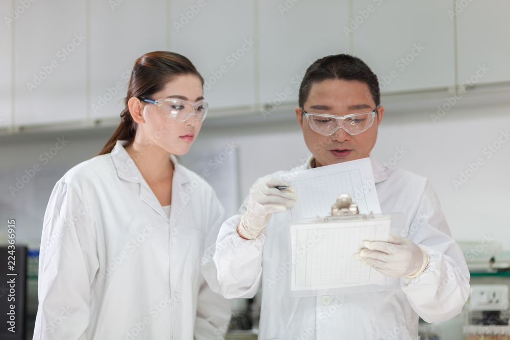 people working at laboratory people working at laboratory