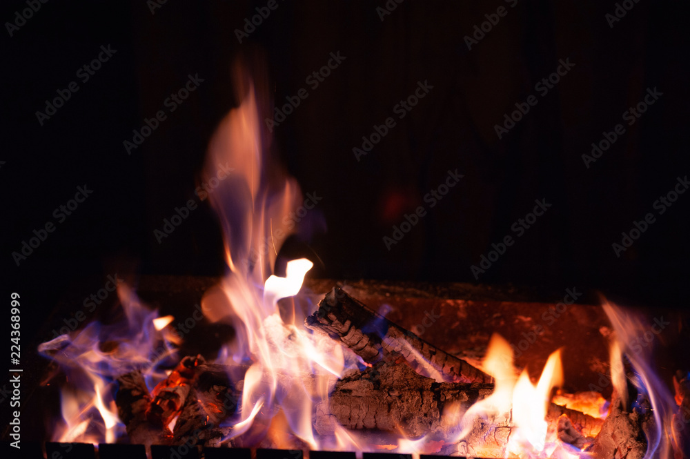 Bright burning wood in a camping on a black background Bright burning wood in a camping on a black background