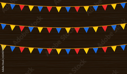 Rope with flags on wood background