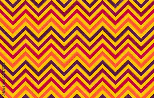 Abstract chevron lines in red to orange hues on yellow background, graphic resource as geometric background, textile print, wallpaper and geometric inspiration