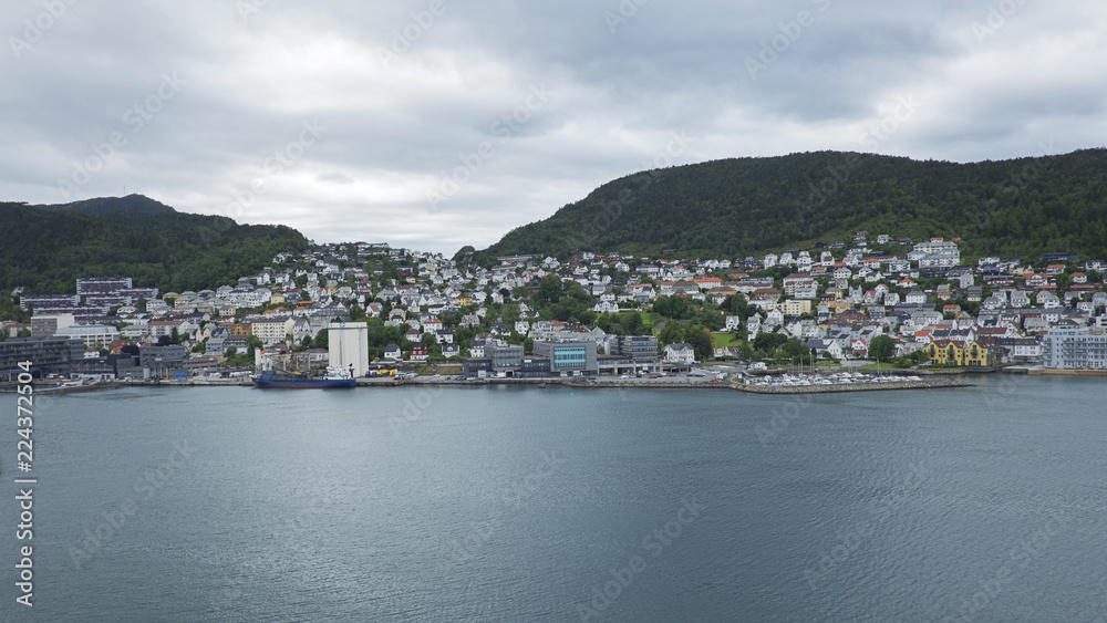 Scenic views of Bergen, city and municipality in Hordaland on the west coast of Norway, surrounded by mountains and fjords. Horizontal shot with perspective from fjord, at high, vantage point