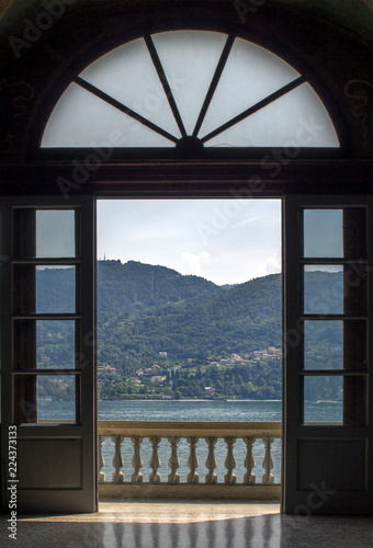 View through the terrace to Lake Como and the Alpine hills above it, Italy.