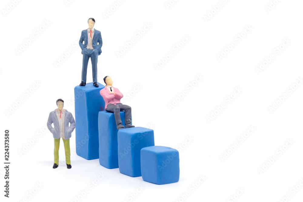 Miniature businessman and graph on white background, Business Growth concept Miniature businessman and graph on white background, Business Growth concept