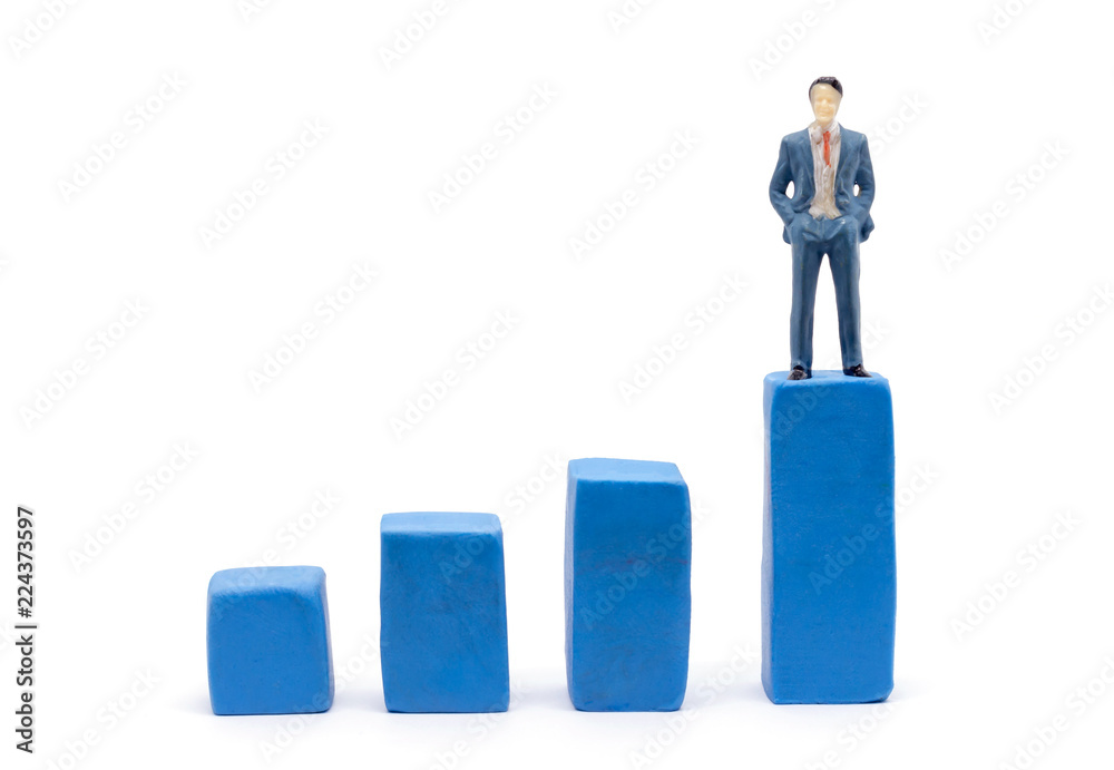 Miniature businessman and graph on white background, Business Growth concept Miniature businessman and graph on white background, Business Growth concept