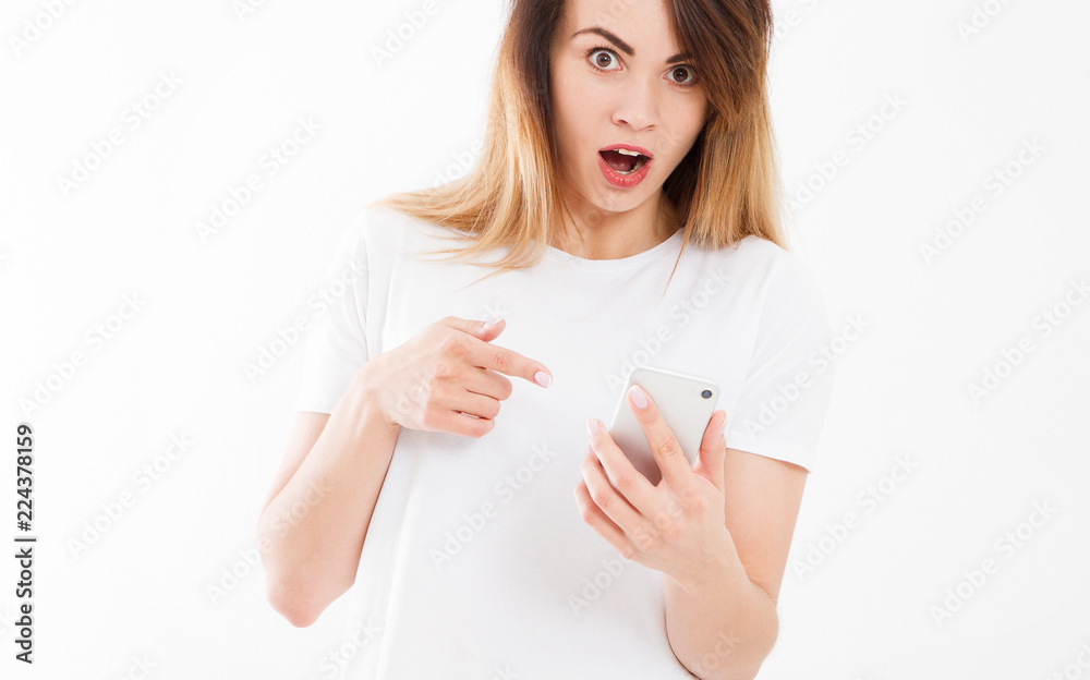 shocked look at phone, cropped portrait surprised young woman looking at smartphone seeing bad news or photos with stunned emotion on face open mouth,copy space shocked look at phone, cropped portrait surprised young woman looking at smartphone seeing bad news or photos with stunned emotion on face open mouth,copy space