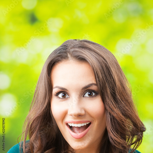 Young happy smiling woman, outdoors