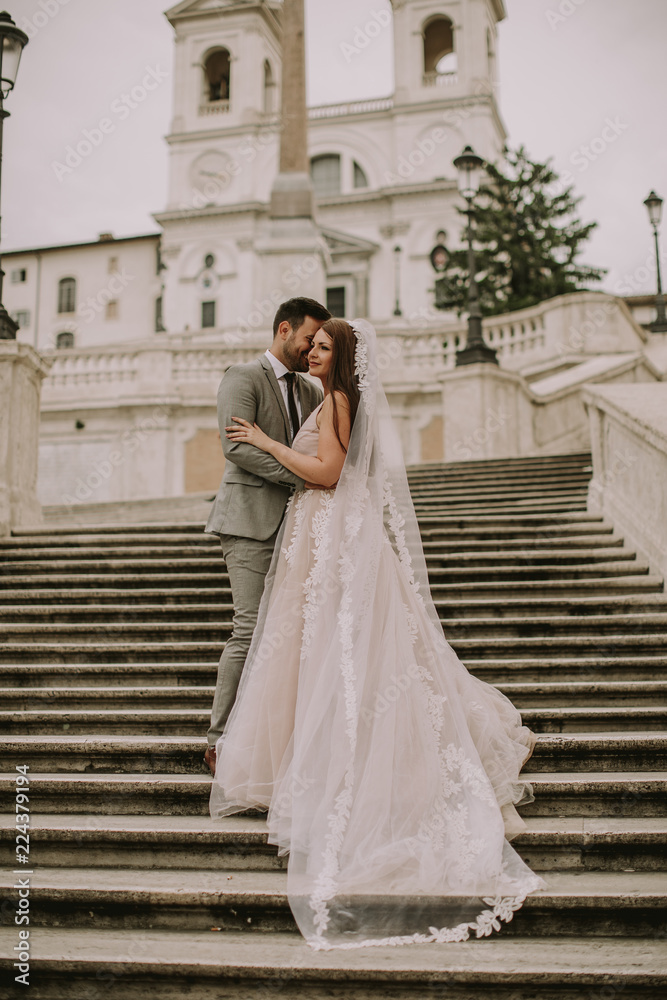 Young wedding couple on Spanish stairs in Rome Young wedding couple on Spanish stairs in Rome