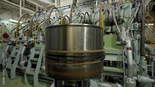 New piston near marine diesel in engine room of ship