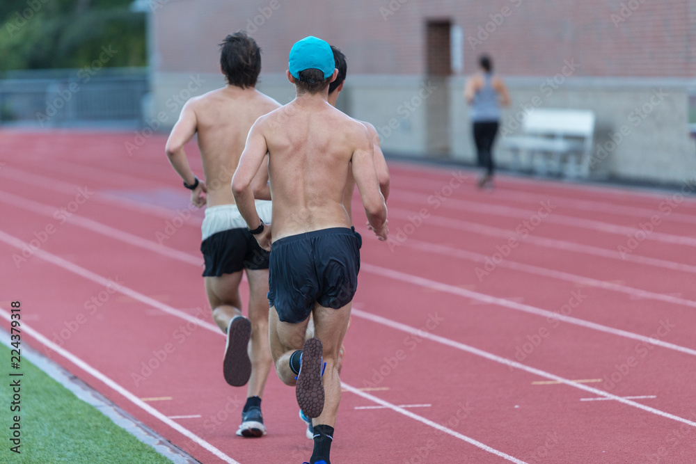 Obraz premium Thre men in black short are running