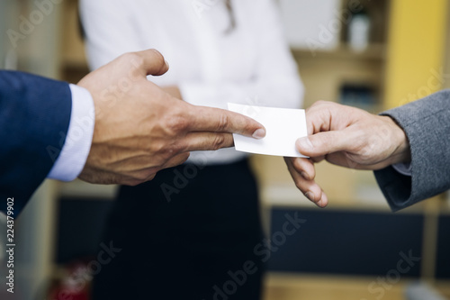 Closeup of businesspeople exchanging business card