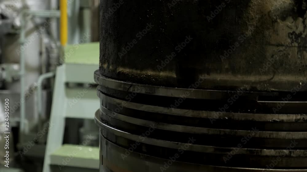 Piston rings on used piston of large diesel engine Piston rings on used piston of large diesel engine