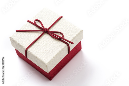 White and red gift box isolated on white background. Copyspace