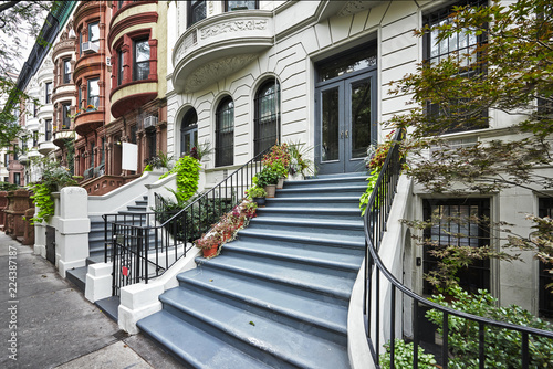 a row of colorful brownstone buildings in Manhattan New York