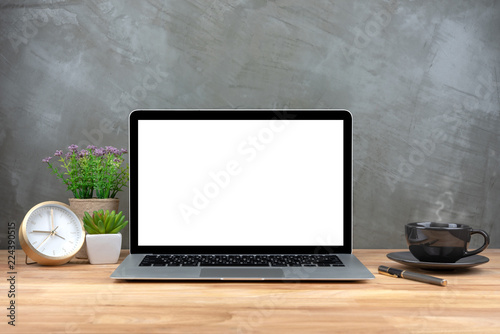 Laptop with blank screen on table