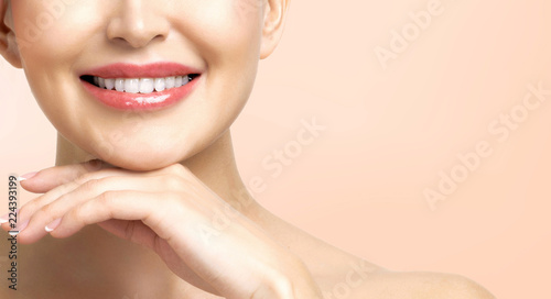 Pretty woman with clean and fresh skin is smiling to you. Beautiful girl portrait