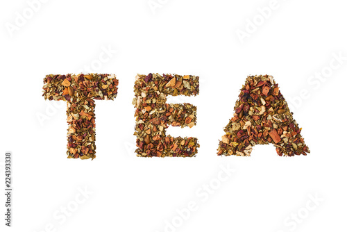 Tea - word written by dried herbs and fruits isolated on white background.