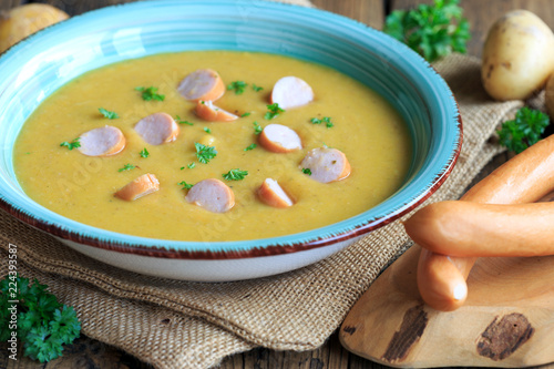 Kartoffelsuppe mit Wurststückchen photo