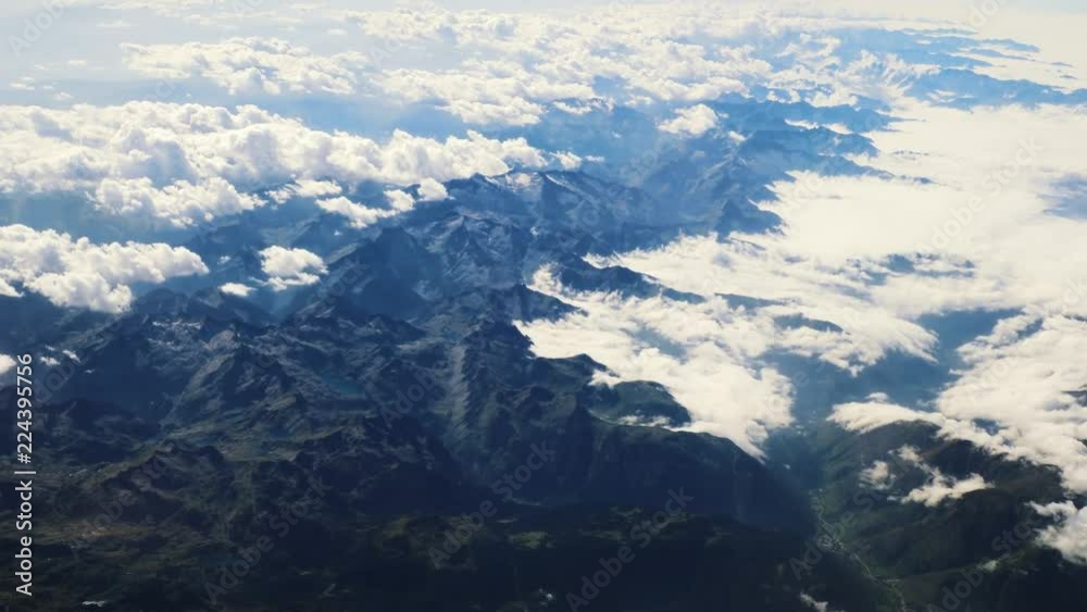 Flying above the clouds and the mountains Flying above the clouds and the mountains