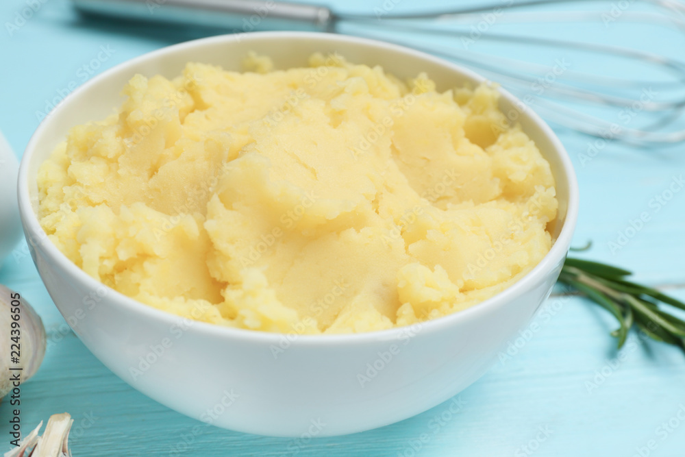 Bowl with mashed potatoes on wooden table Bowl with mashed potatoes on wooden table