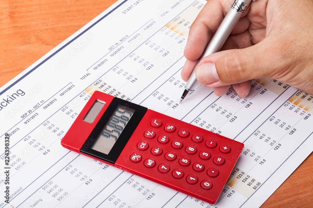 Close-up of a Businessman Analyzing Financial Figures with Close-up of a Businessman Analyzing Financial Figures with